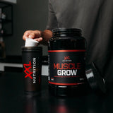 Muscle Grow post-workout shake being prepared with an XXL Nutrition shaker
